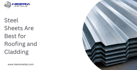 Stack of galvanized corrugated steel sheets used for industrial roofing and cladding panels by Heera Metals.